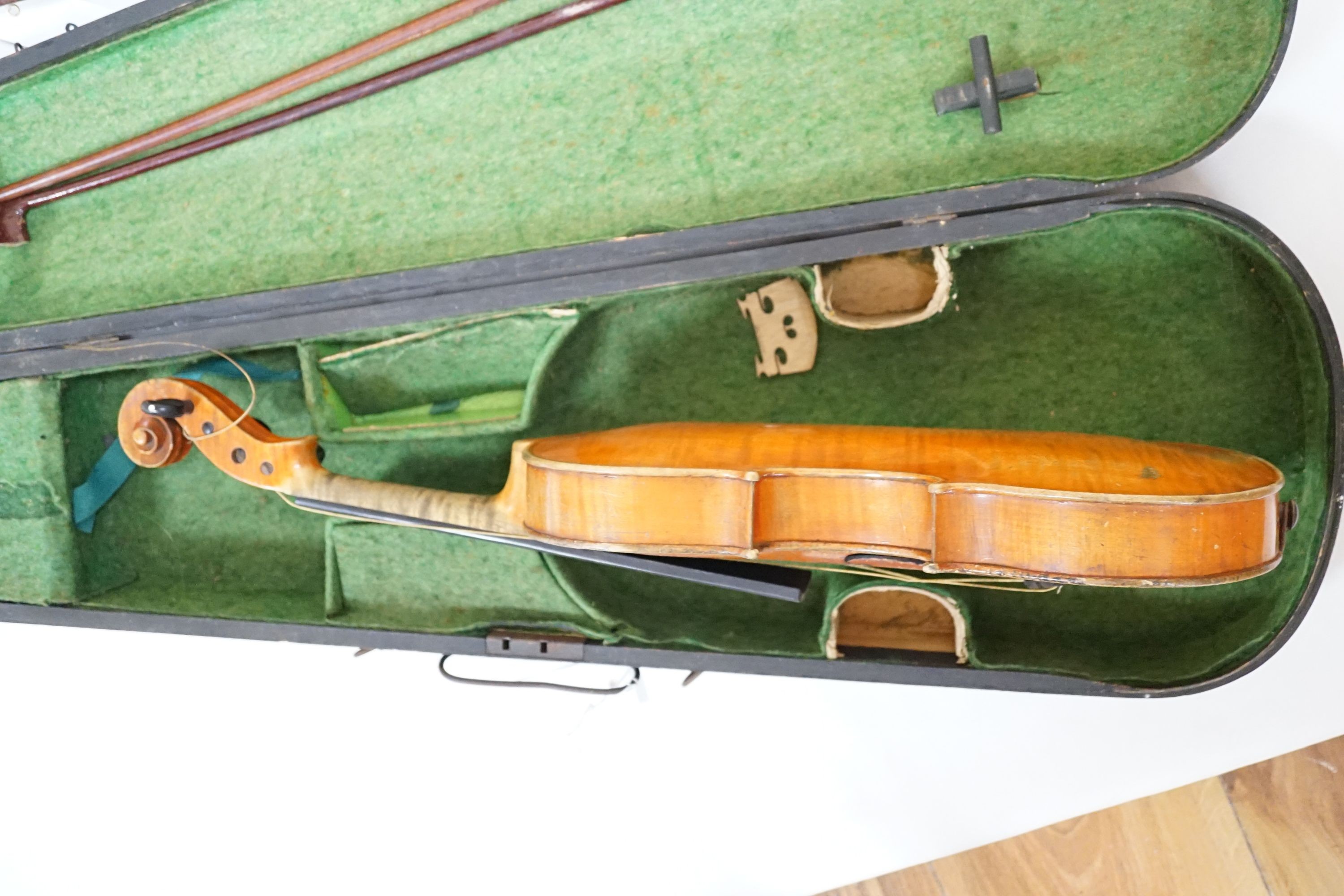 A 19th century 3/4 size violin, cased with 2 bows and 1 other German violin